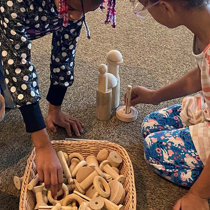 Girls playing with Kodo Wooden Loose Parts Kit